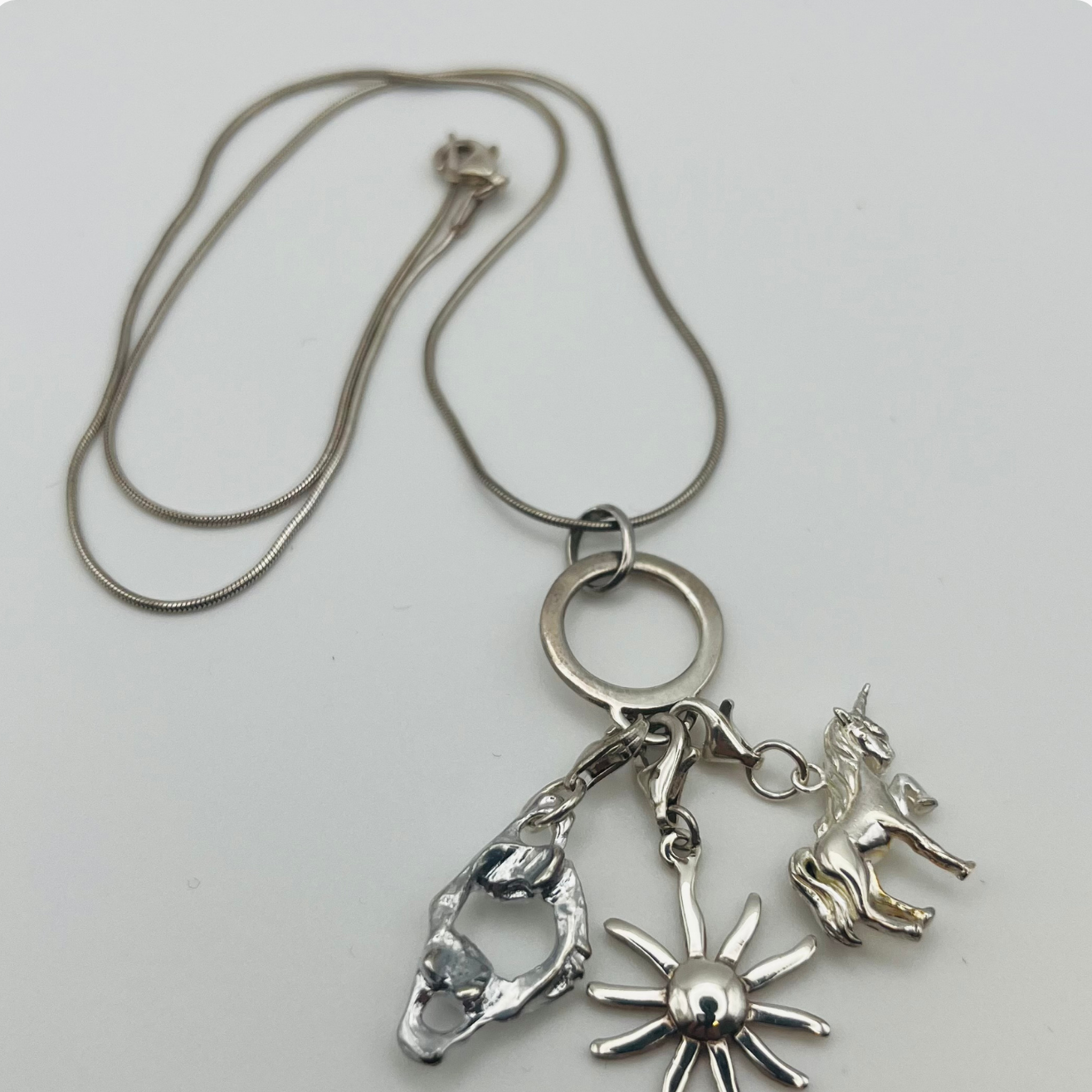 Sterling Silver Atlas, Sun, and Unicorn Necklace